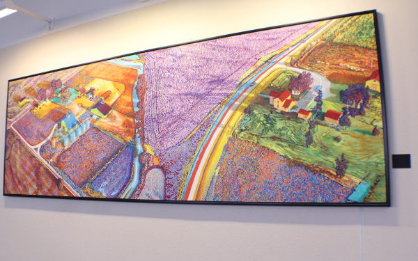 Large wall art hanging near baggage claim